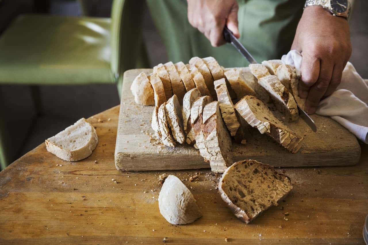Fresh bread sliced on a chopping board