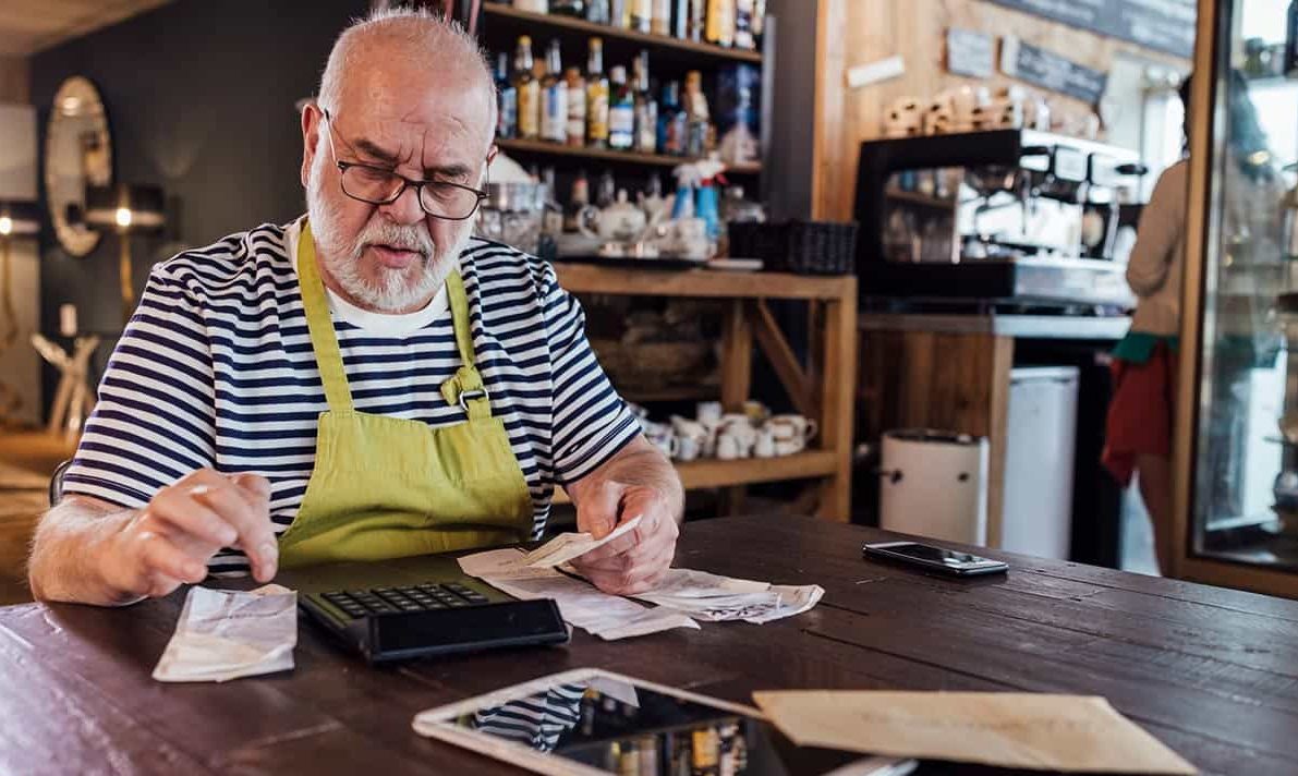 Business owner reviewing tax records in a coffee shop