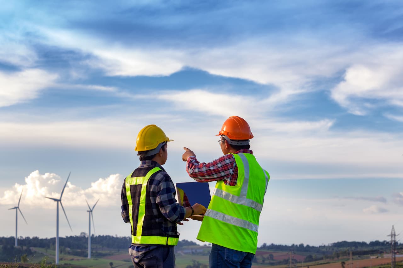 Engineers outdoors at a wind farm