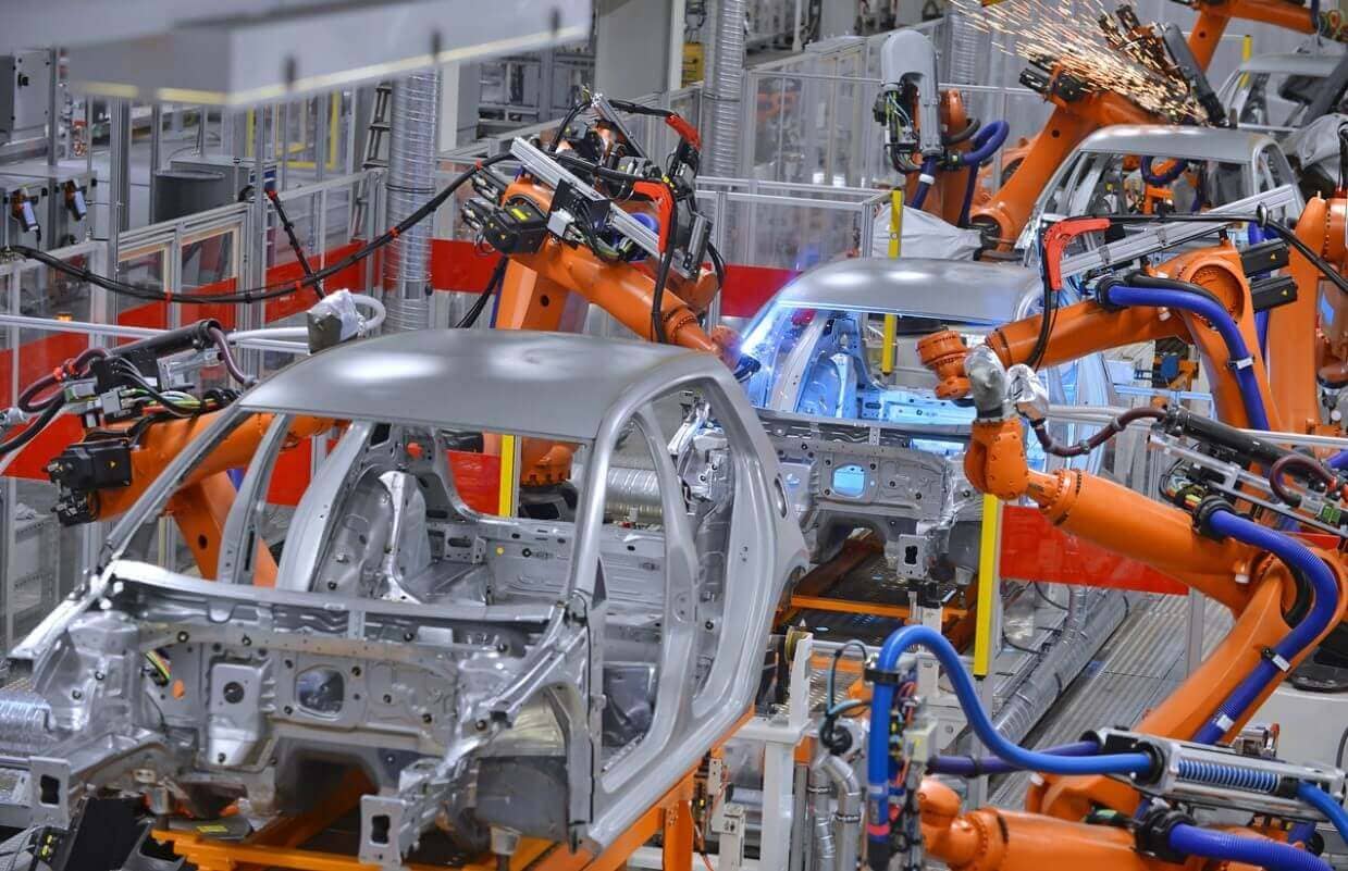 Robots manufacturing cars in a factory