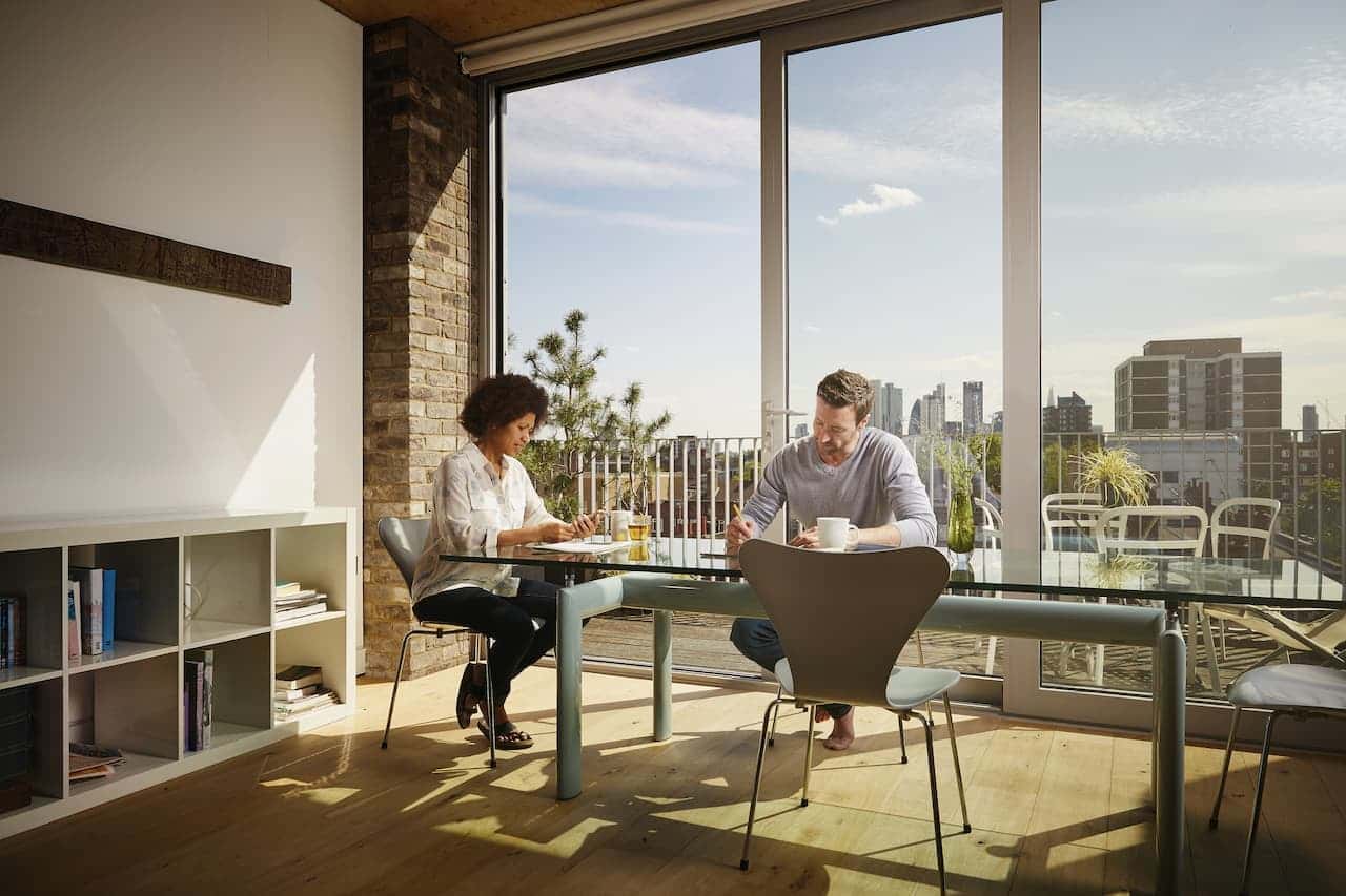 Couple working from home in a modern apartment