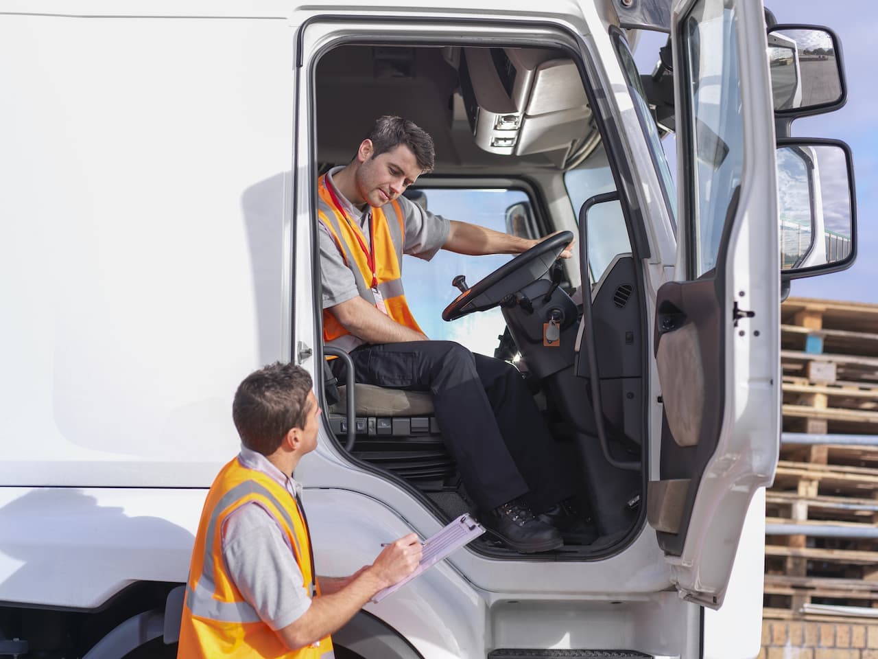 Truck driver talking to a colleague