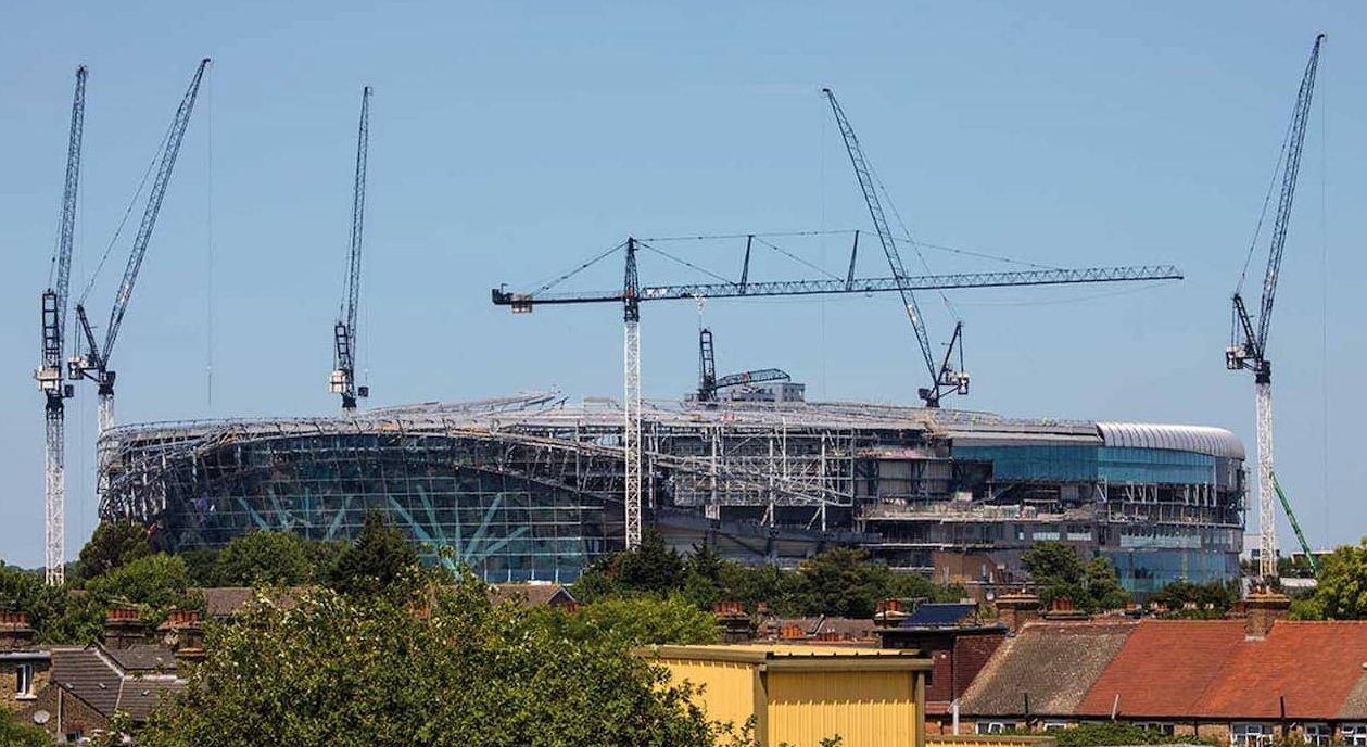 Tower cranes surround a stadium in London
