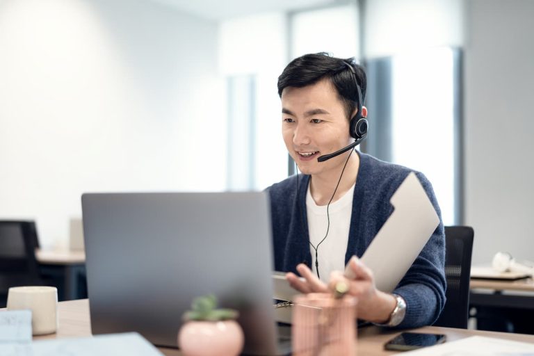 Customer service adviser working on a computer