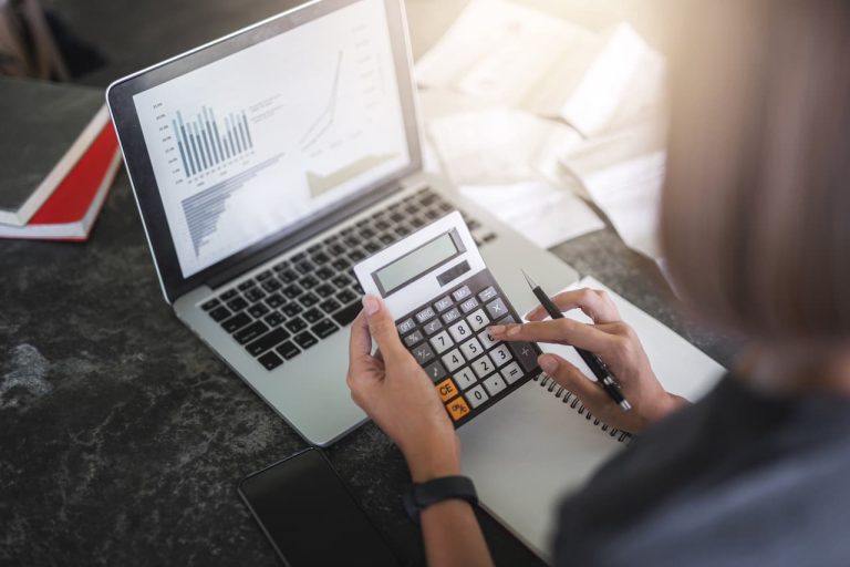 Accountant using a calculator