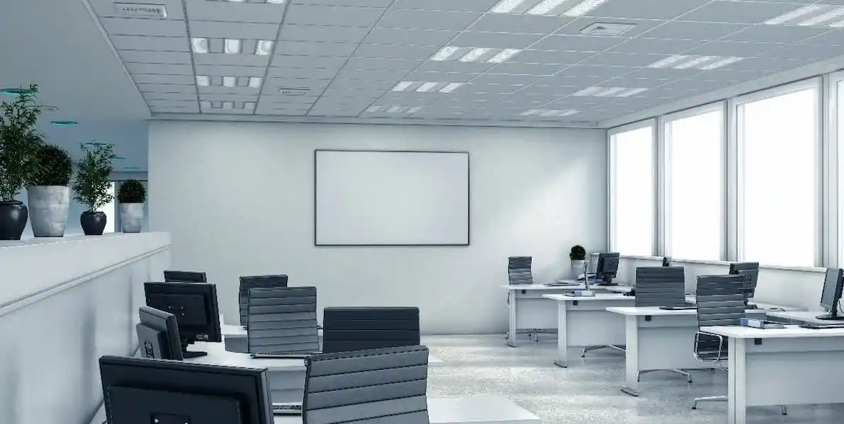 A modern office space with white walls and black chairs, creating a clean and professional atmosphere.