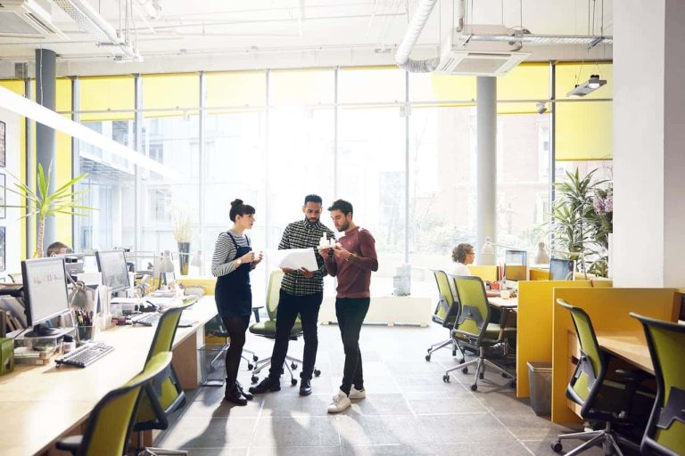 Office workers talking in a group