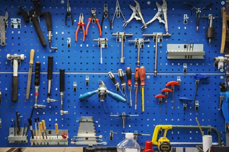 Blue tool rack with a selection of tools on display