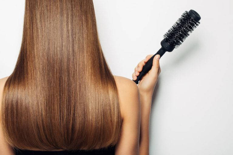 Person holding a hair brush
