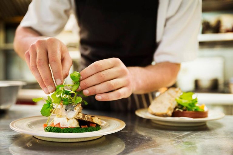Chef plating up some food