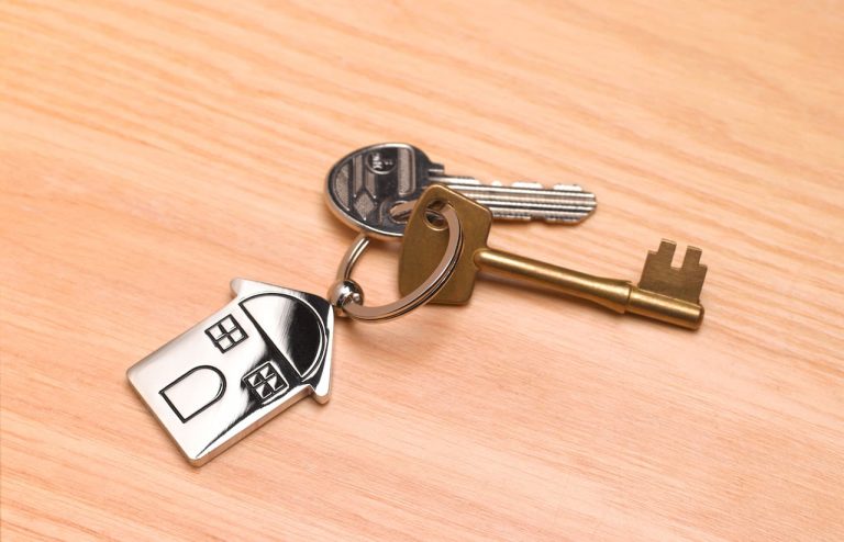 House keys on a light coloured desk