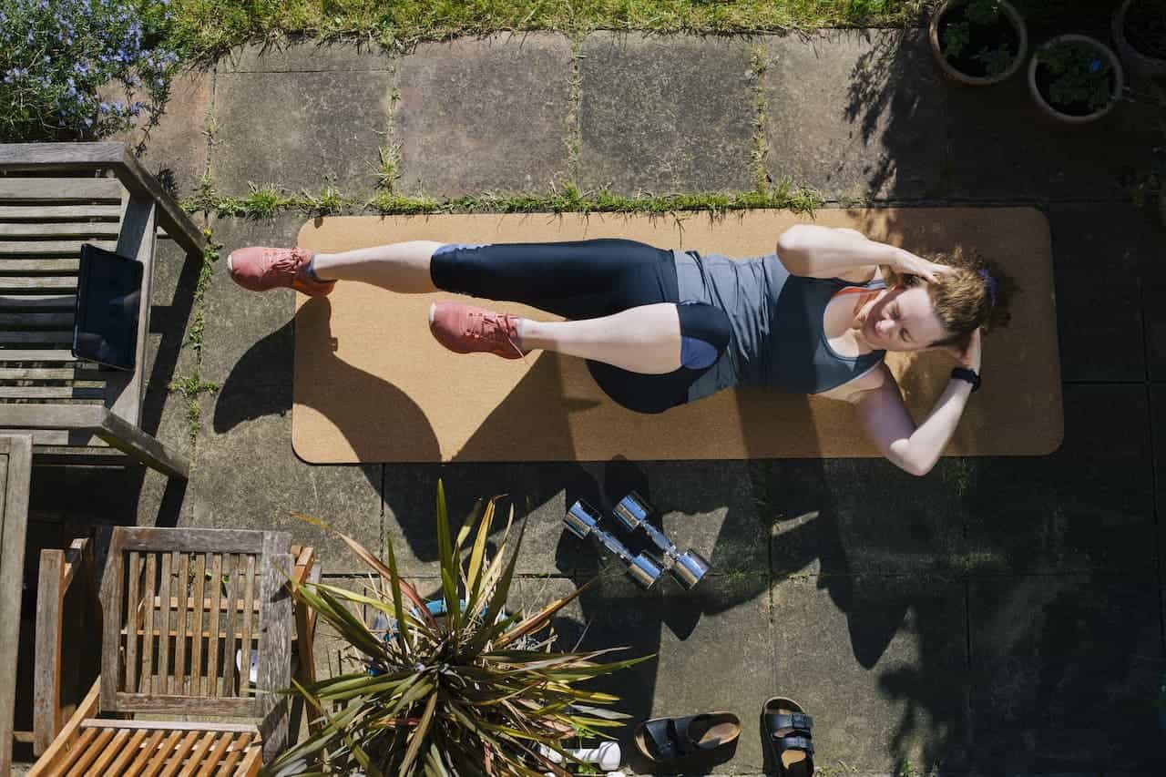 Person doing a workout in the garden