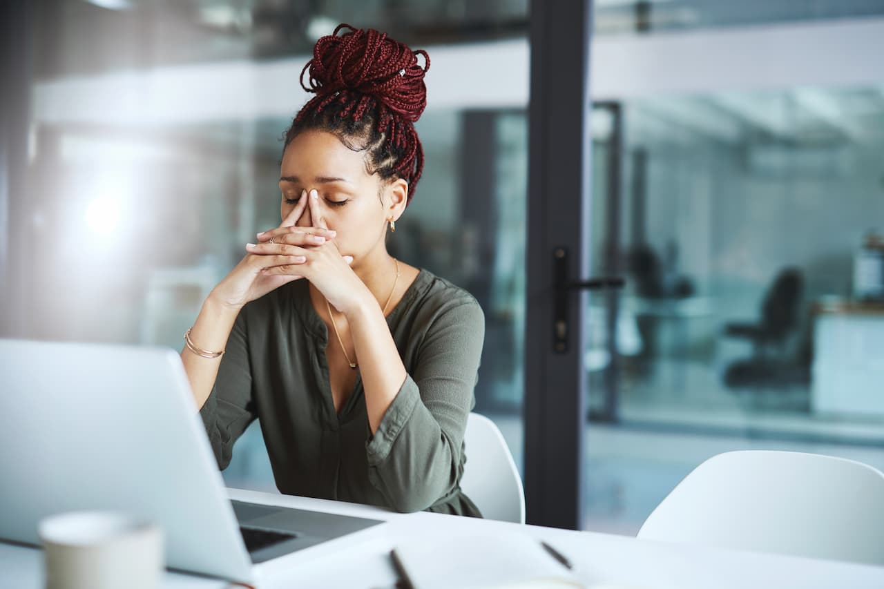 Stressed person working at a desk
