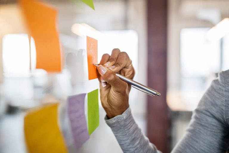 Teacher writing notes on a board