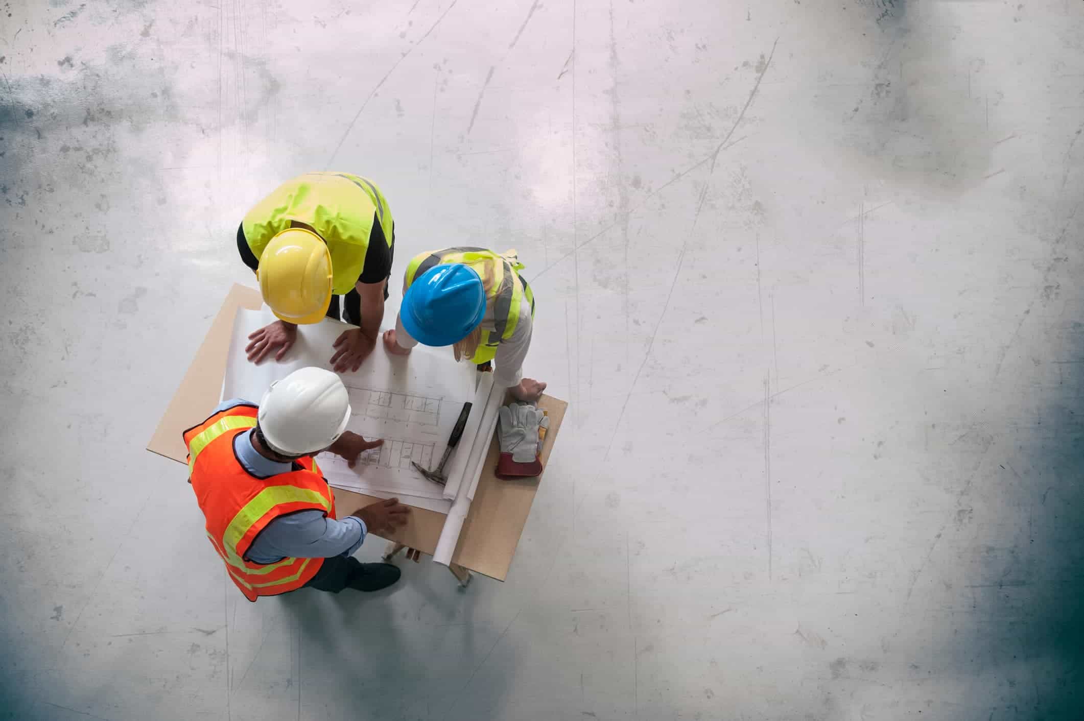 Construction contractors looking at planning documents