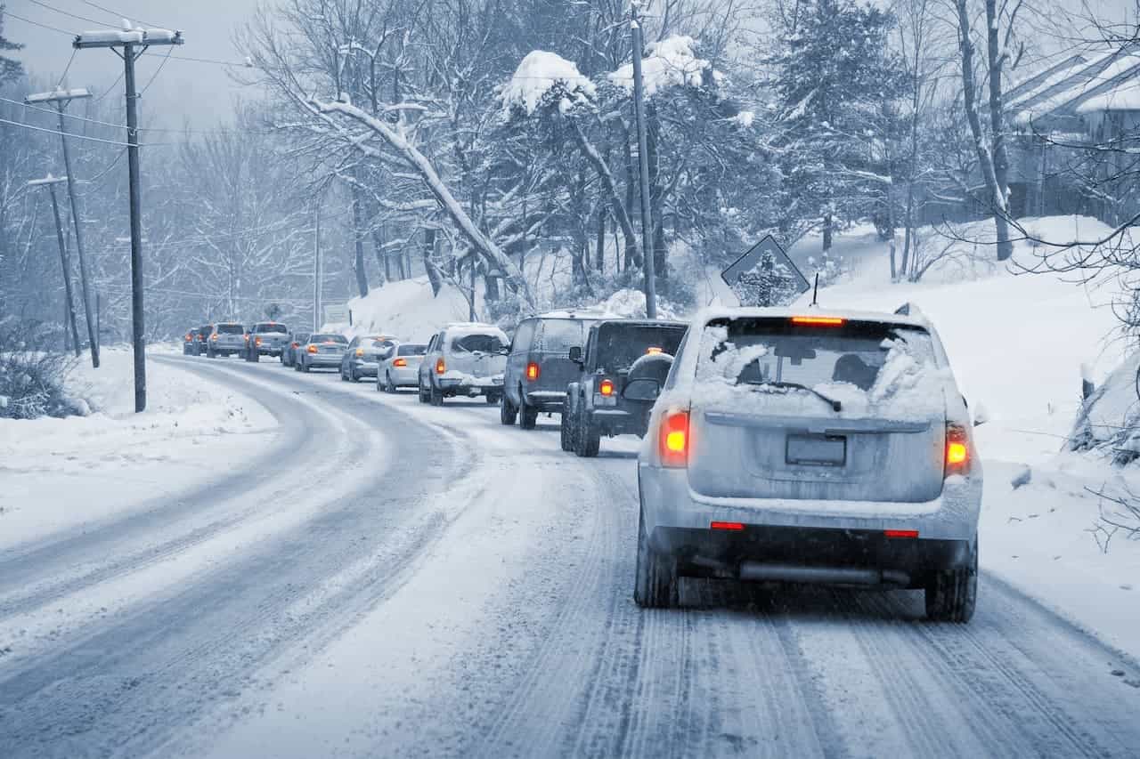 Cars driving down an icy road