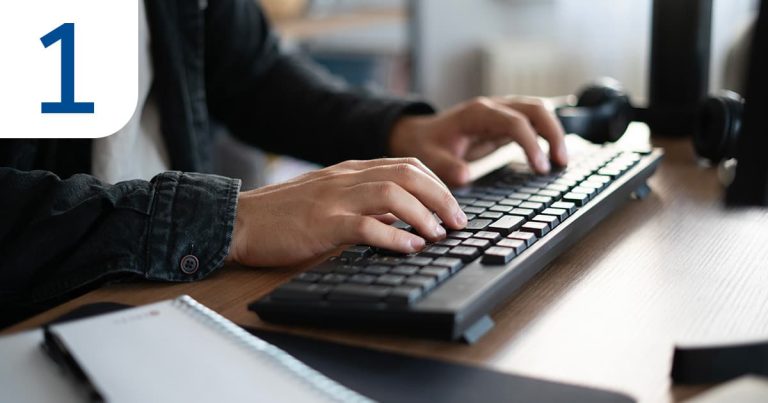 A person typing on a keyboard while completing a quick online form.