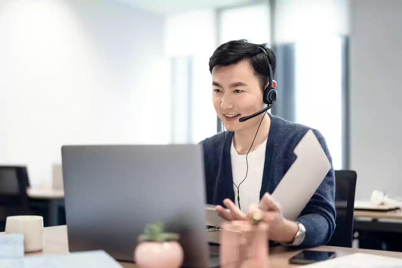 Customer service adviser working on a computer