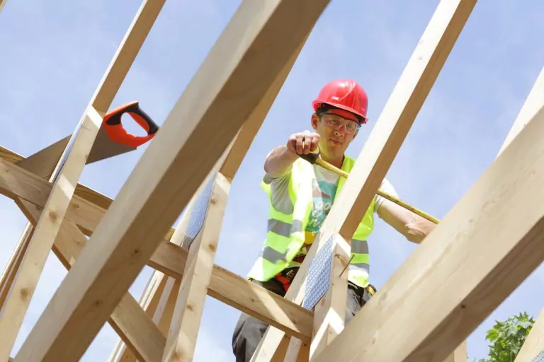Contractor working on a roof structure